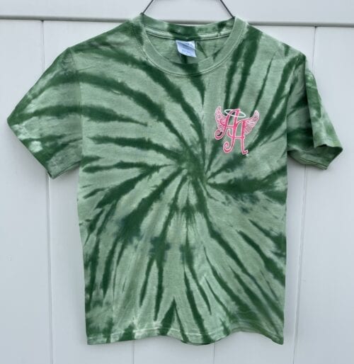 green tie-dye shirt with Ainsley’s Angels of America logo