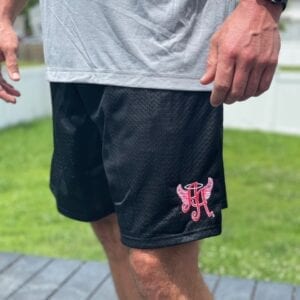 black shorts with Ainsley’s Angels of America logo (different angle)